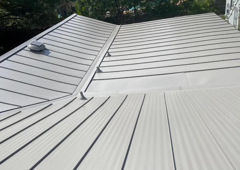 Solar attic fan installed on a metal roof for Roof Ventilation in Pinehurst